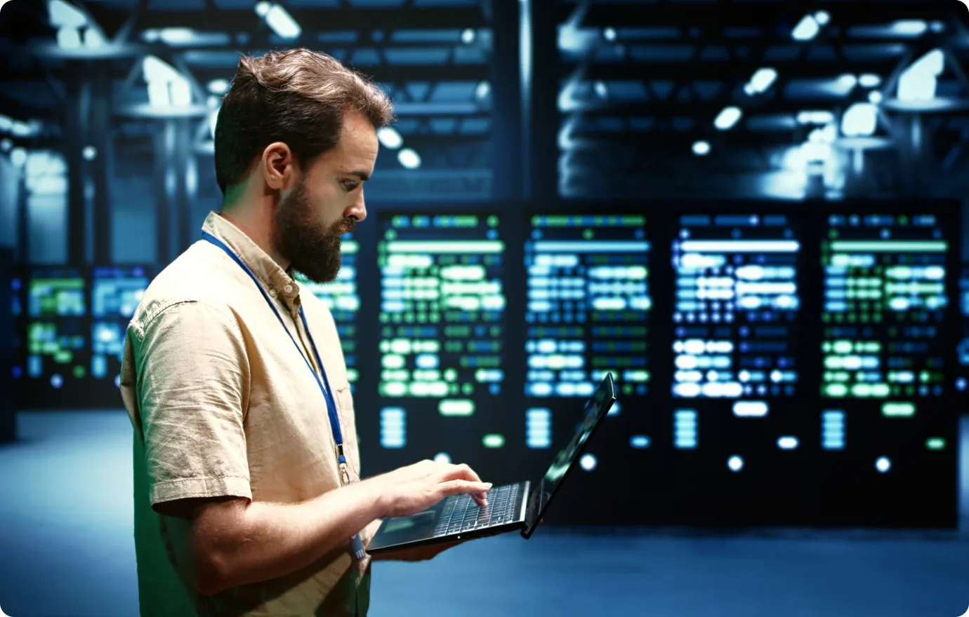 Engineer working on a laptop in a data center