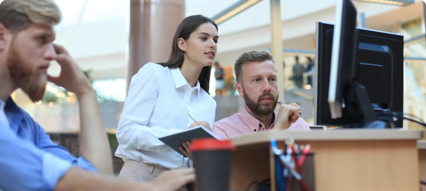Security team reviewing systems together at a workstation